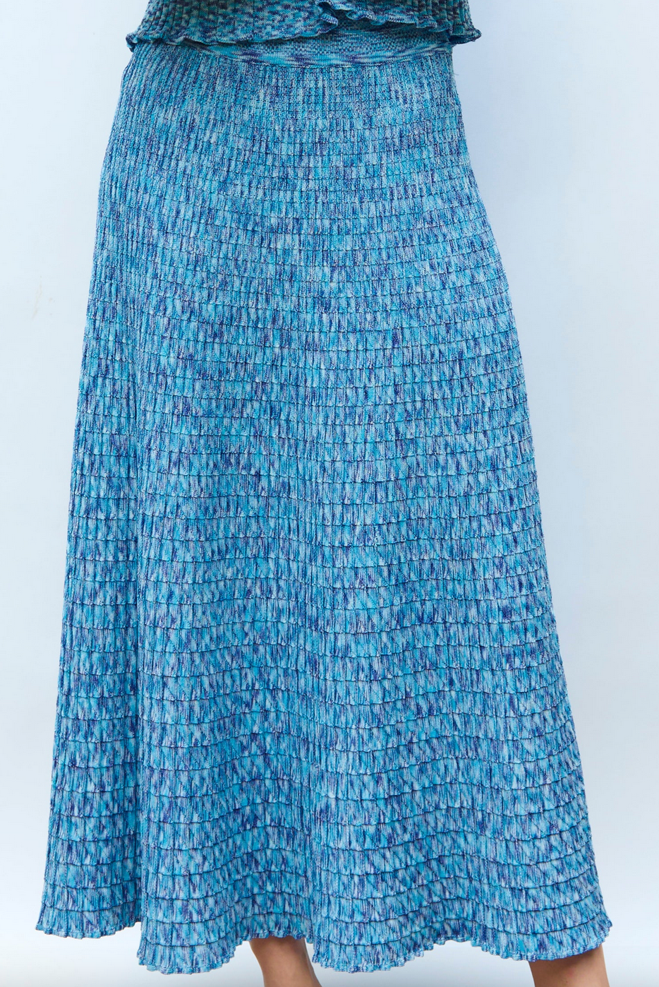 Cocktail fluid skirt in origami knit pool