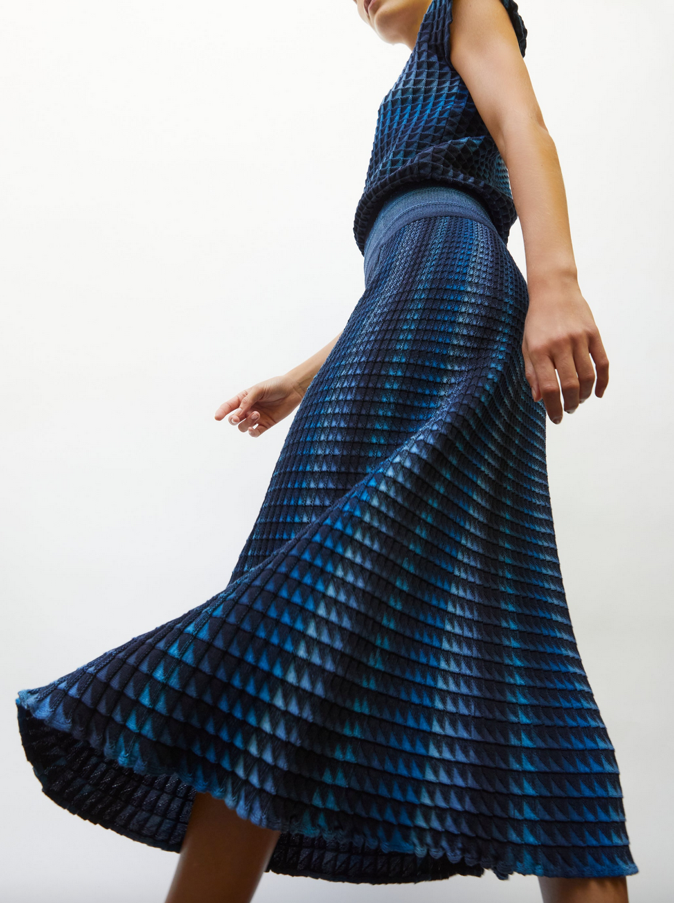 cocktail fluid skirt in an origami knit midnight-denim