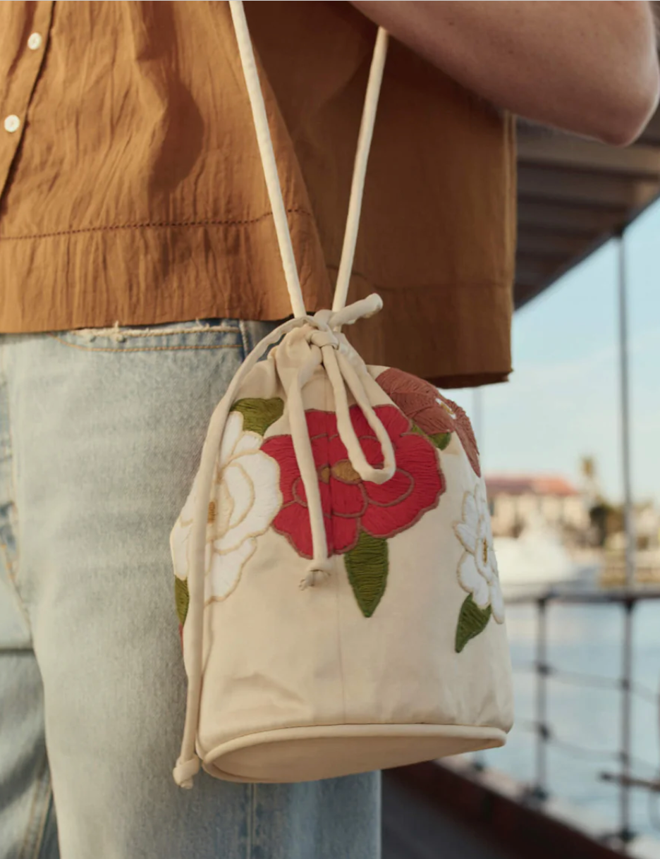 The embroidered cinched bucket bag white